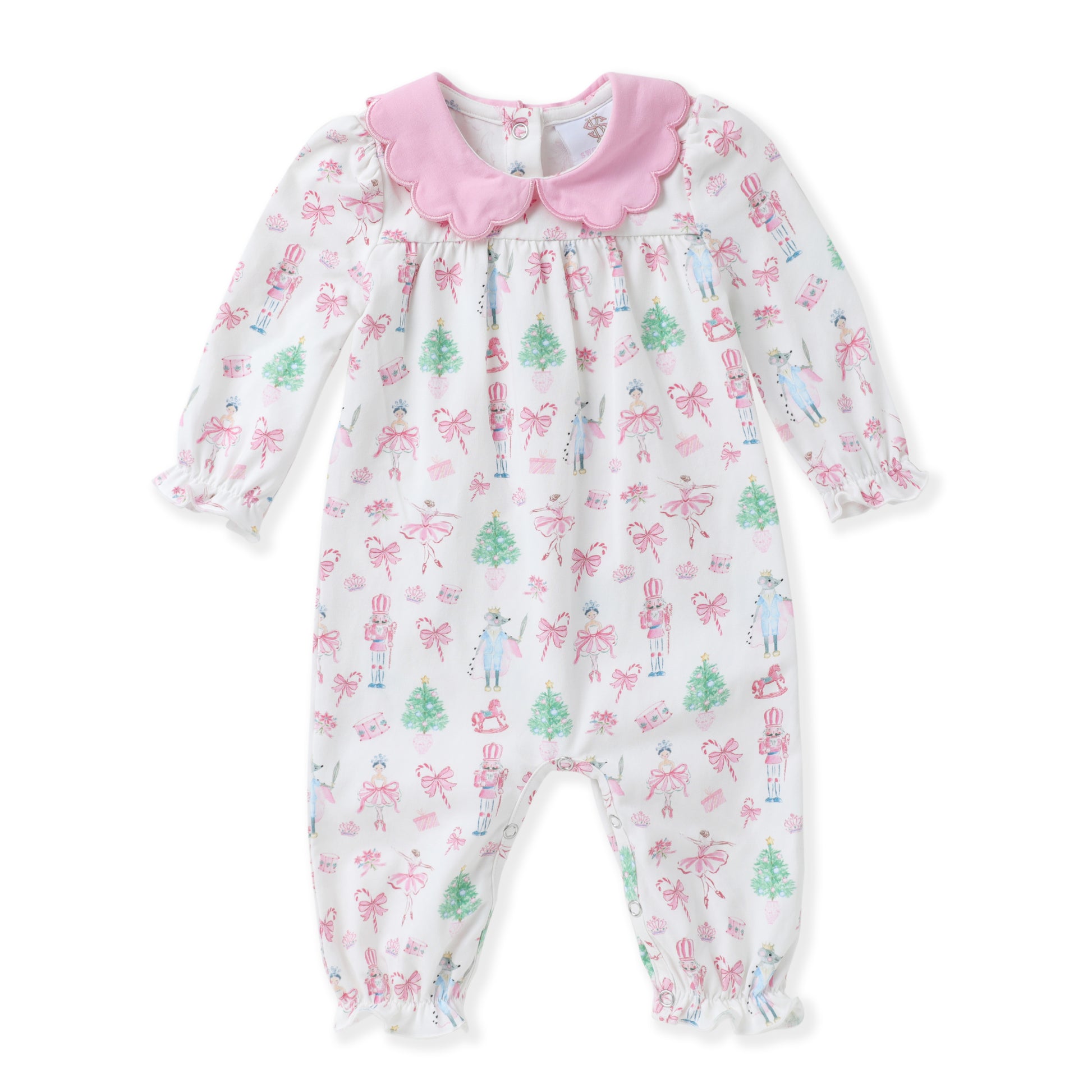 A baby girl's long-sleeve footless romper in white, decorated with a pink bow and green Christmas tree pattern, featuring a pink ruffled collar and bow.