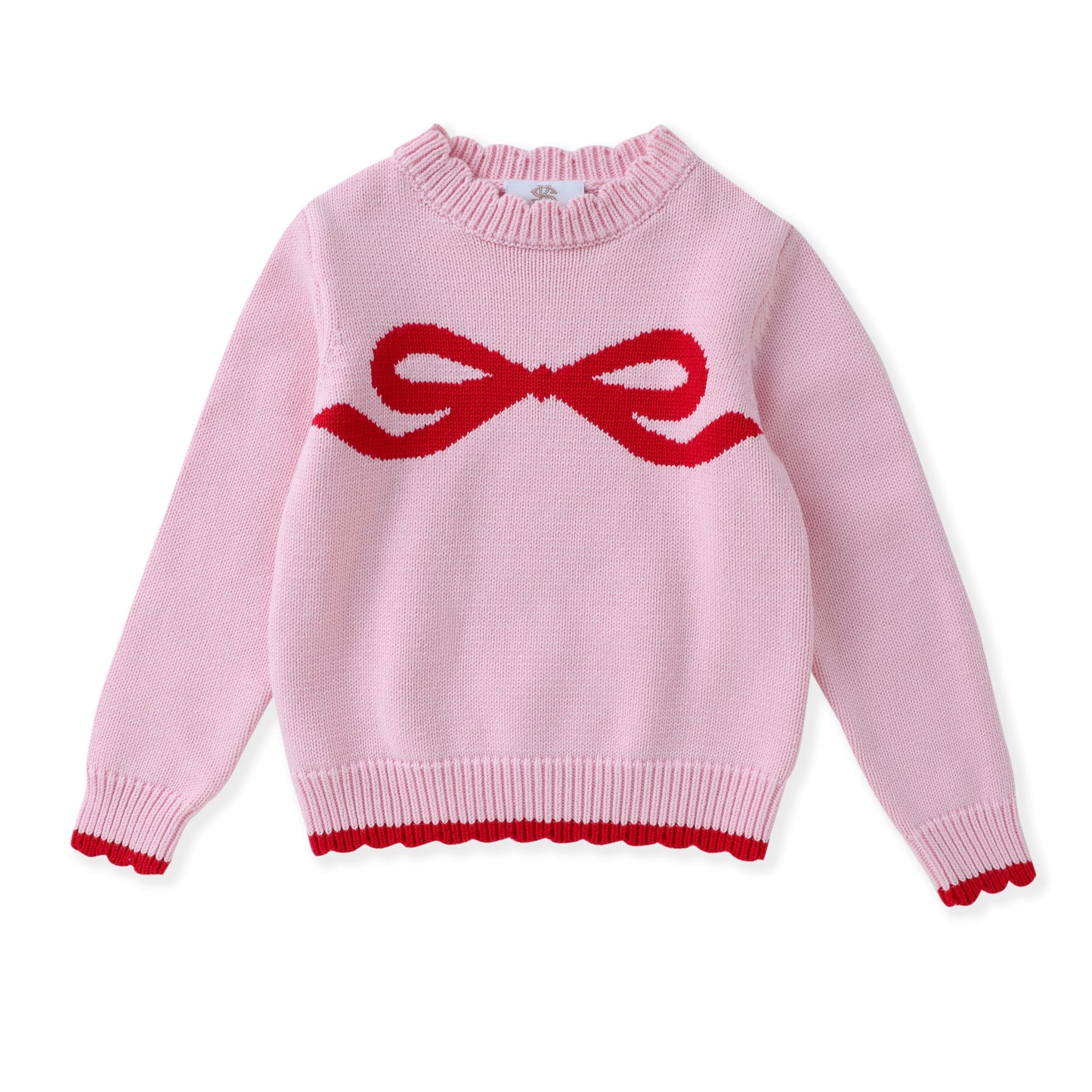 A light pink knit sweater with a red knitted bow motif across the chest and a matching red scalloped trim at the hem and cuffs, shown on a plain white background.