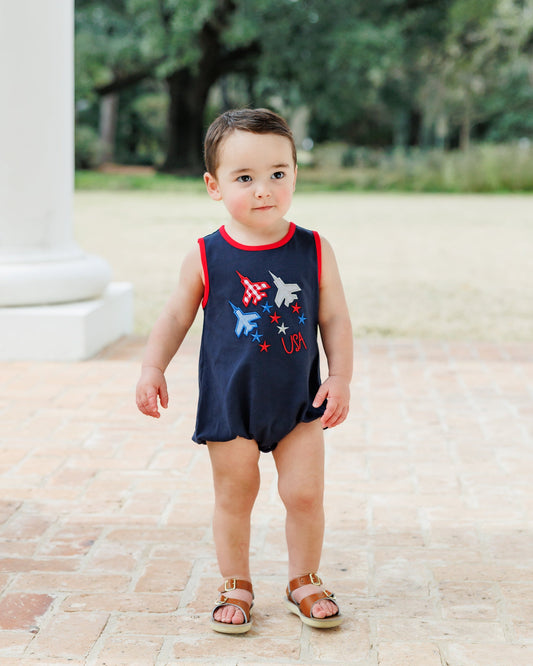 Navy blue bubble with red white and blue airplane and star design.