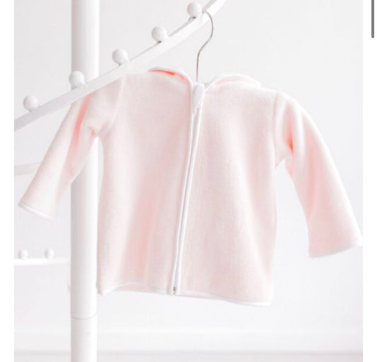 A pale pink hooded zip-up cardigan or sweater displayed on a white clothing rack against a bright white background.