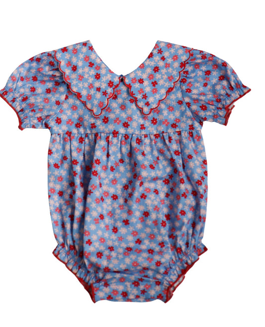 Baby romper with red white and blue floral pattern with a wide collar 