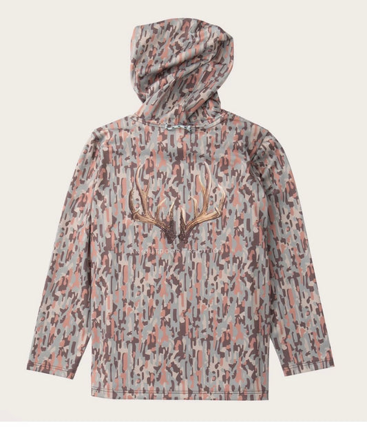 A hooded long-sleeve shirt with an abstract camouflage pattern in gray, pink, and brown, featuring a large antler graphic on the chest, shown against a light beige background.