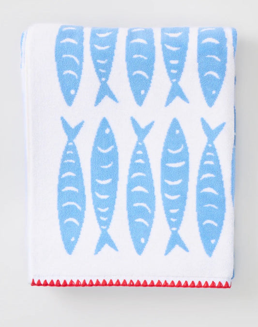 White towel with red white and blue fish pattern on both sides 