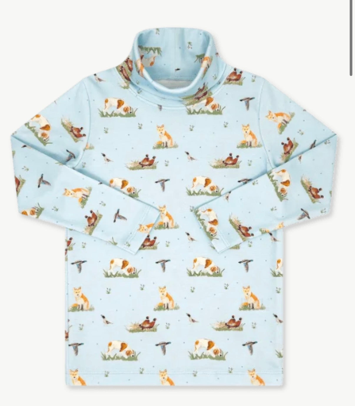 A light blue long-sleeve mock neck top with an all-over print of foxes, birds, and small outdoor motifs on a white background.