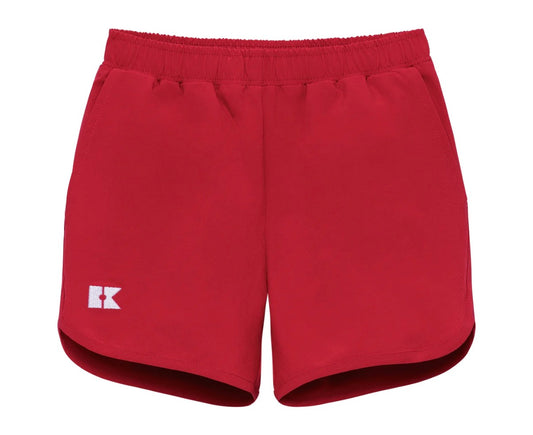 Red shorts with a logo on right front leg 