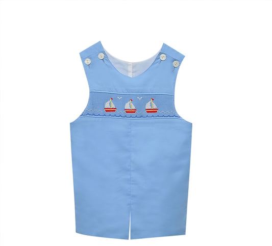 Light blue shortall with embroidered sailboats on smocking.