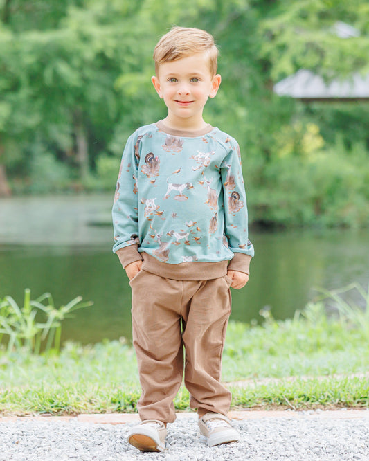 green hunting sweatshirt with brown jogger pants 