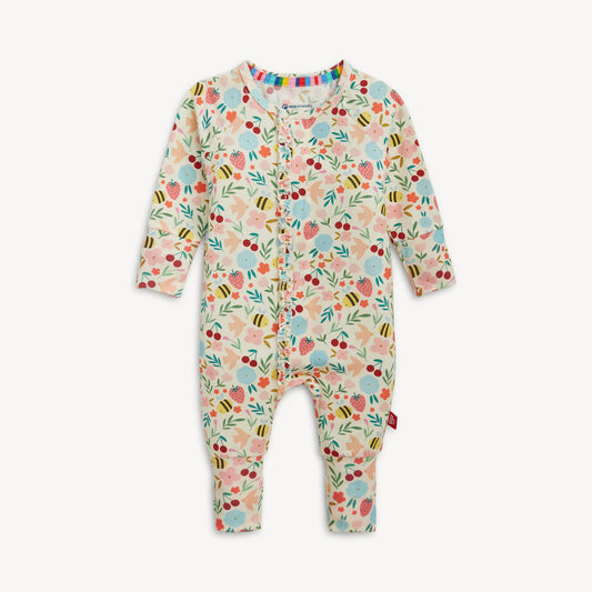 Colorful baby coverall with flowers, strawberries and bees.