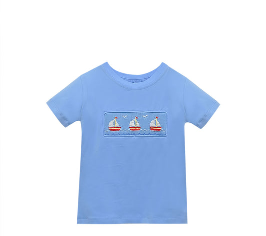 Light blue short sleeve tshirt with embroidered sailboats on smocking.
