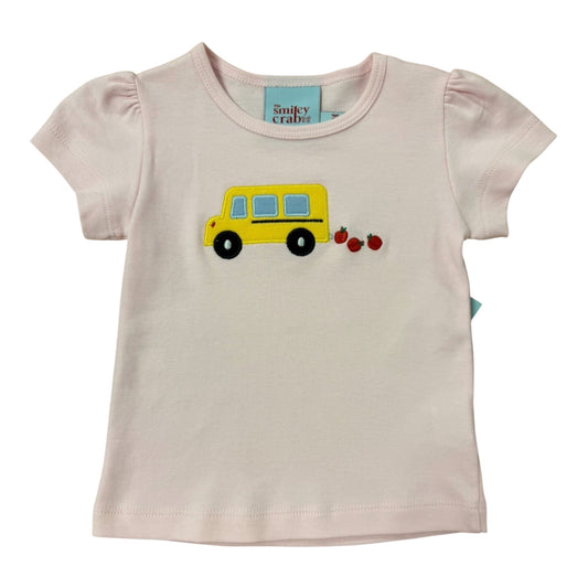Pink t-shirt with a yellow school bus and red apples