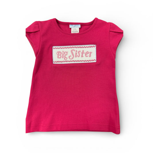 Pink  smoked shirt with 'Big Sister' text on a white background