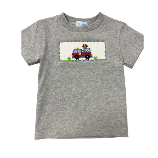 Gray smocked shirt with a fire truck design on a white background