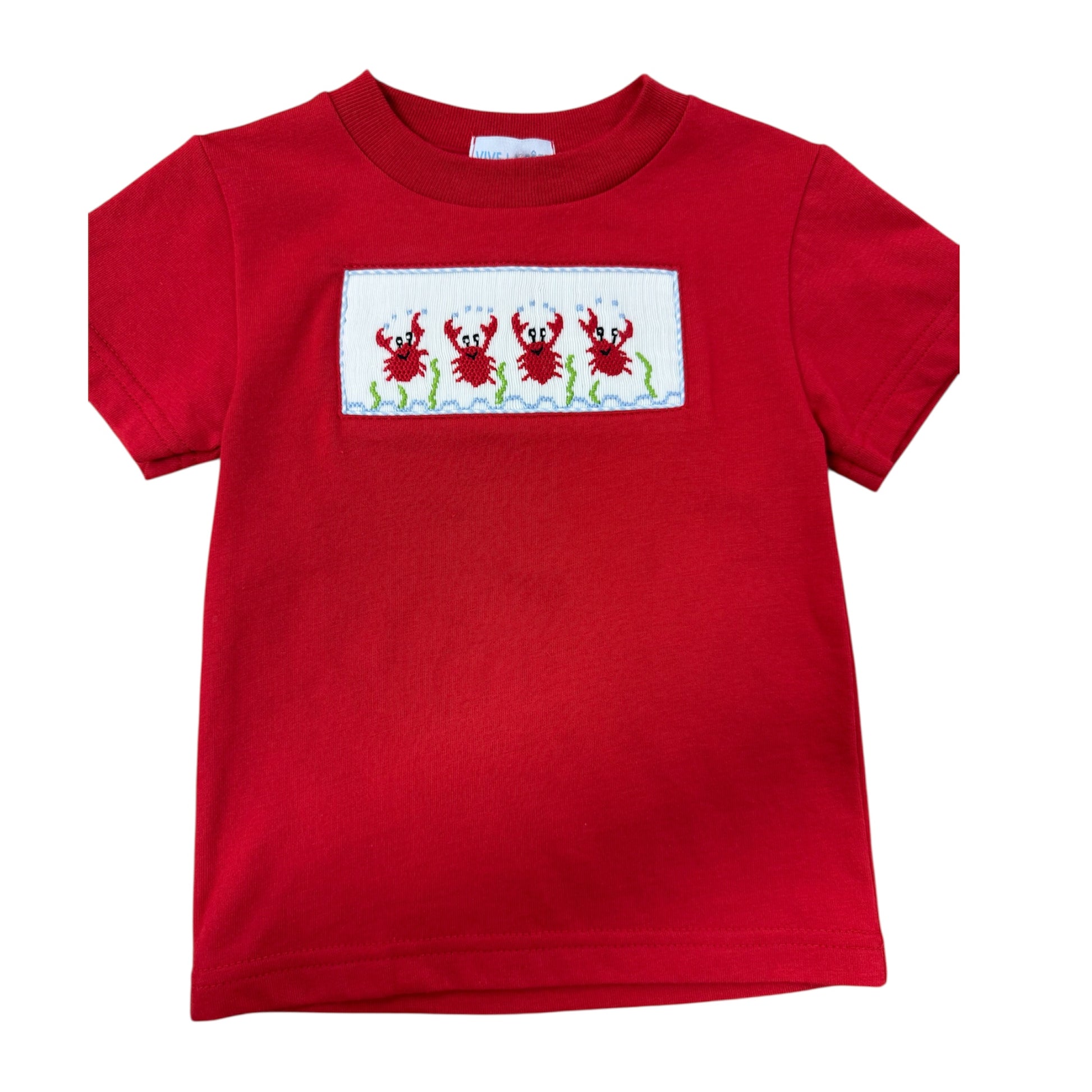 Red smocked shirt  featuring embroidered  crab designs on a white background