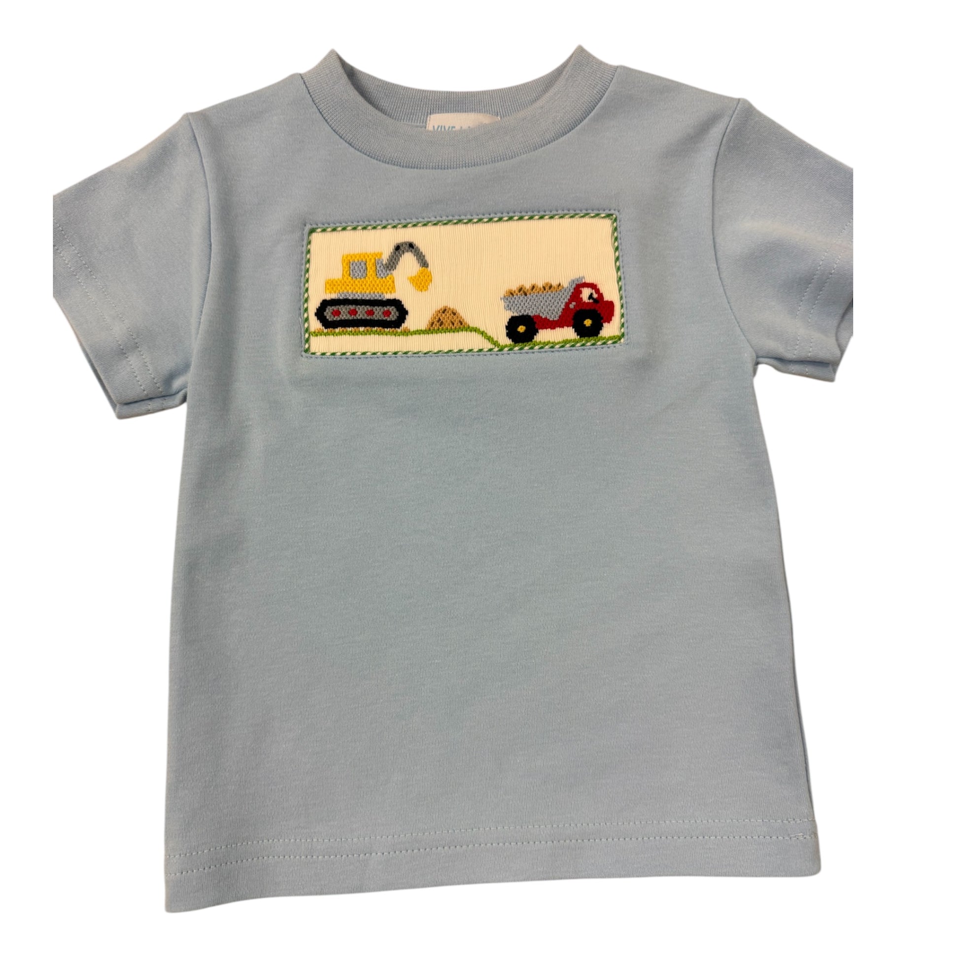 Blue Smocked shirt with a construction-themed patch on a white background