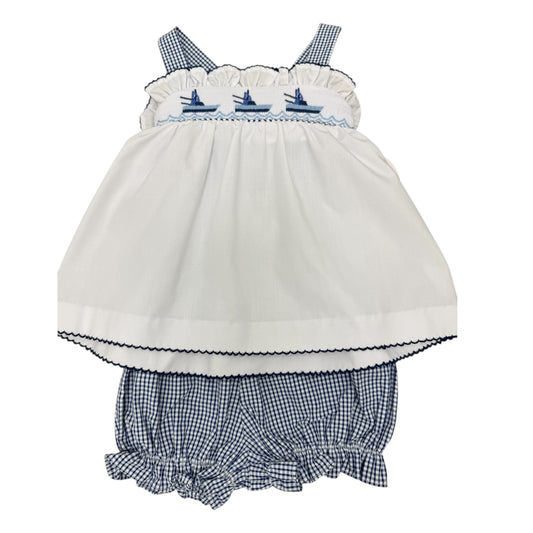 White baby smocked top with navy blue checkered bloomers with three boats across the chest.