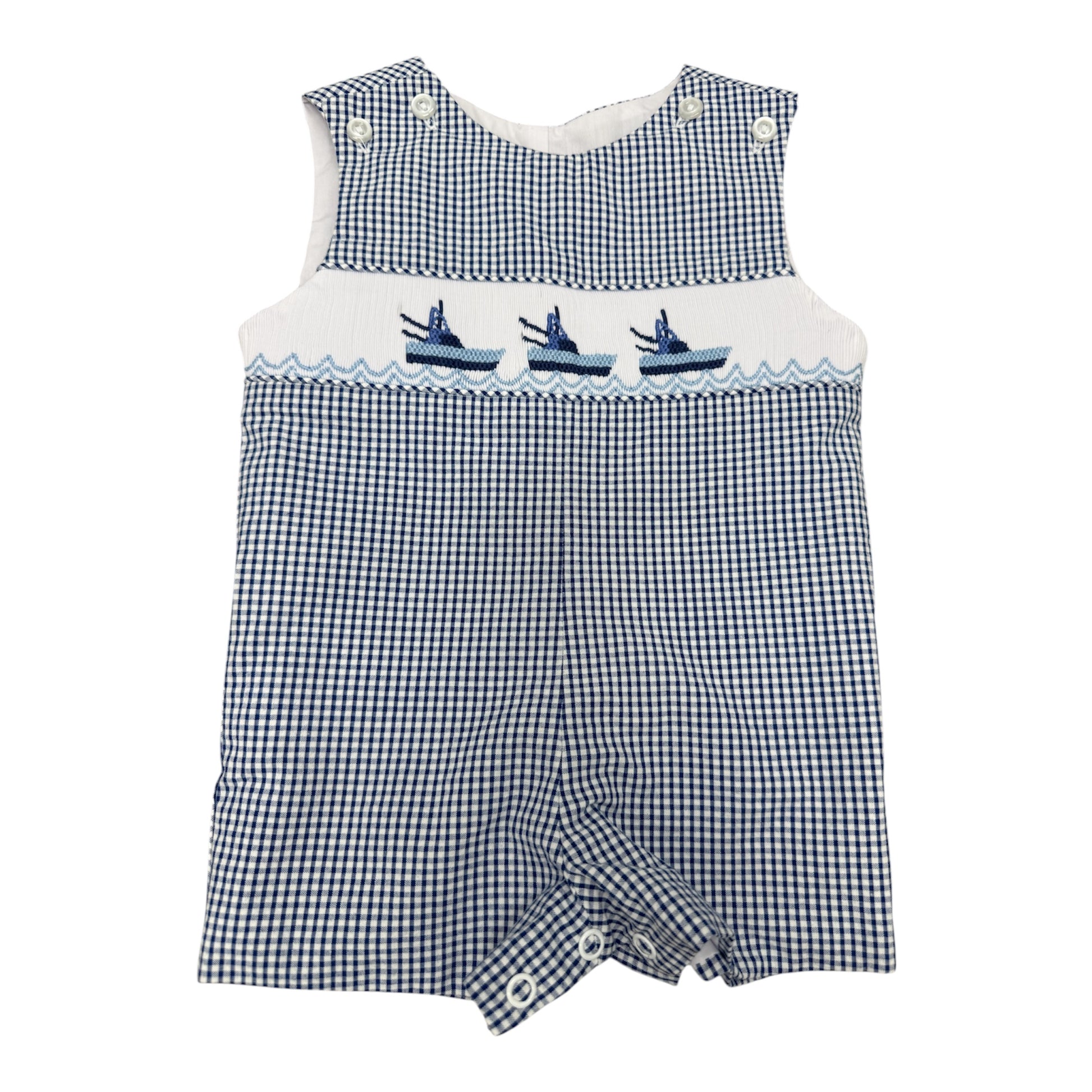 Blue and white checkered smocked romper with embroidered boats on a white background