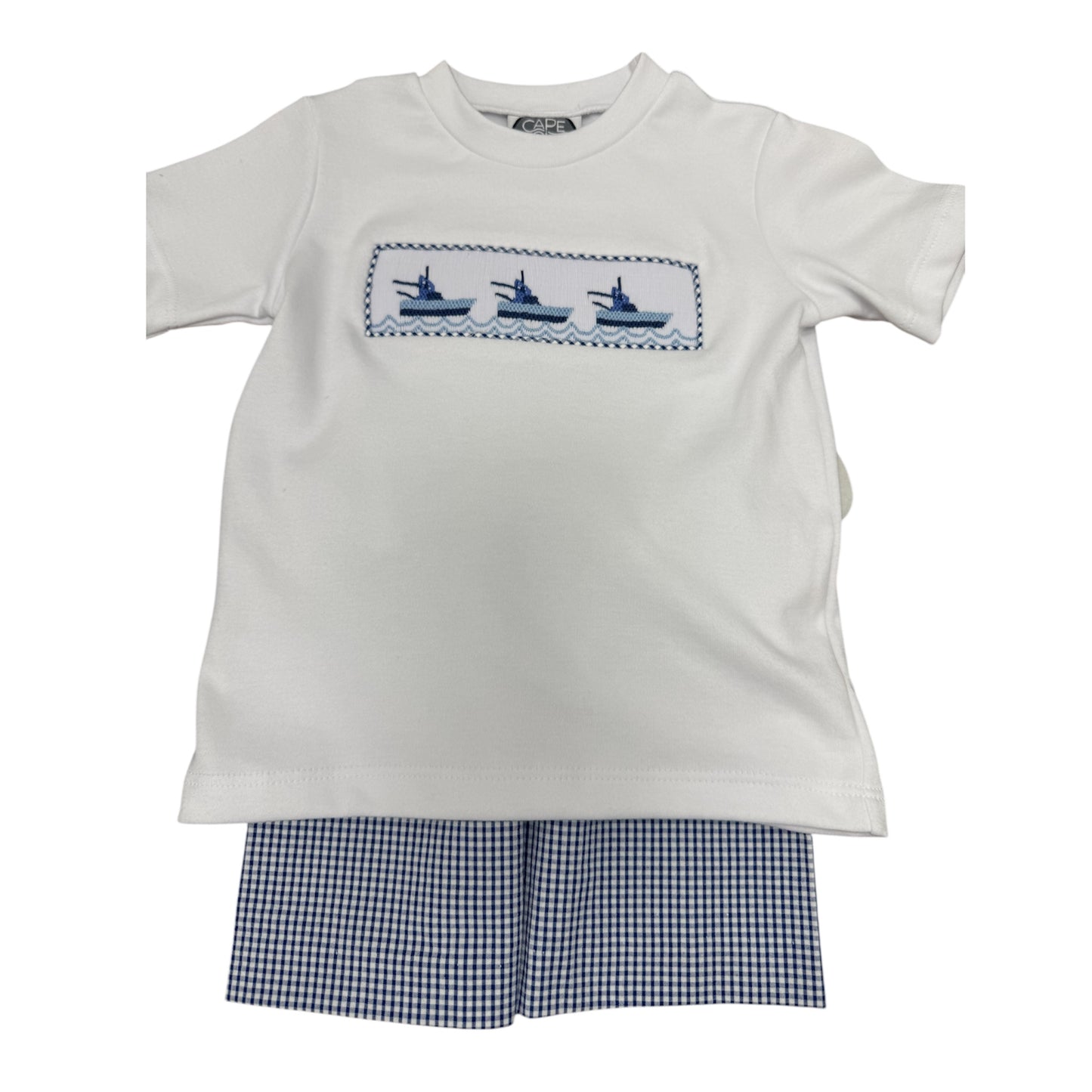 White smocked t-shirt with three boats across the chest and blue checkered shorts