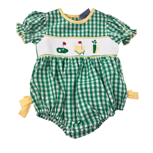 Green checkered baby romper with golf-themed design on a white background