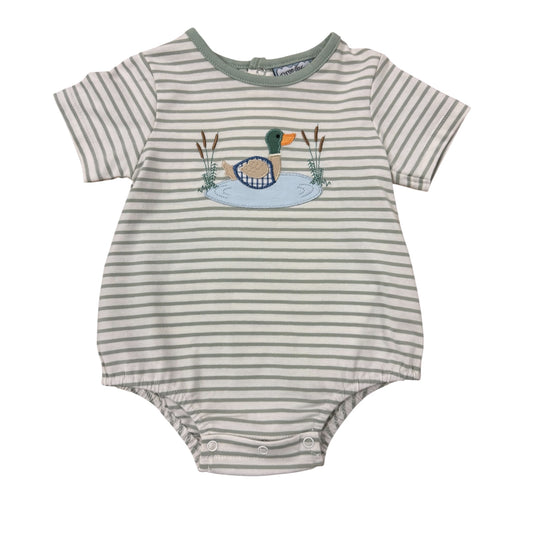 Striped baby romper with duck design on a tan background