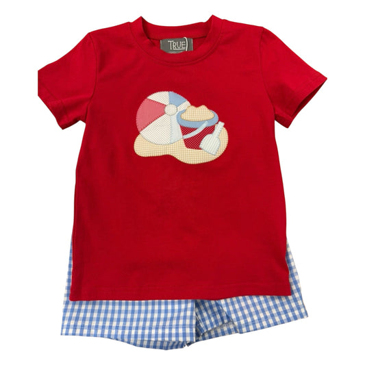 Red t-shirt with a beach ball design and blue checkered shorts 