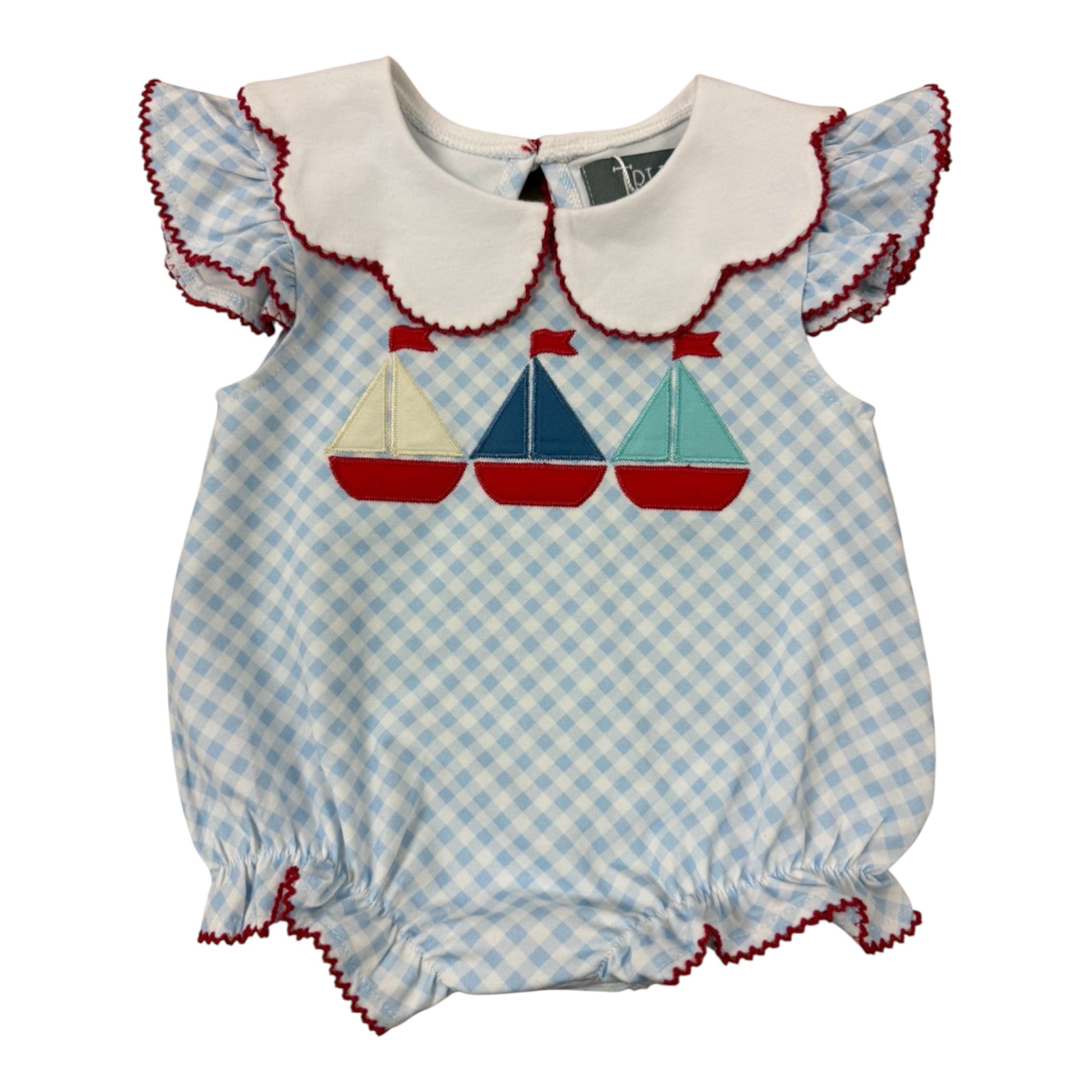 Baby bubble with checkered  blue and white pattern with sailboat design with red trim around edges