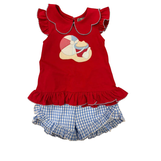 Red top with ruffled collar with beach scene and blue checkered shorts 