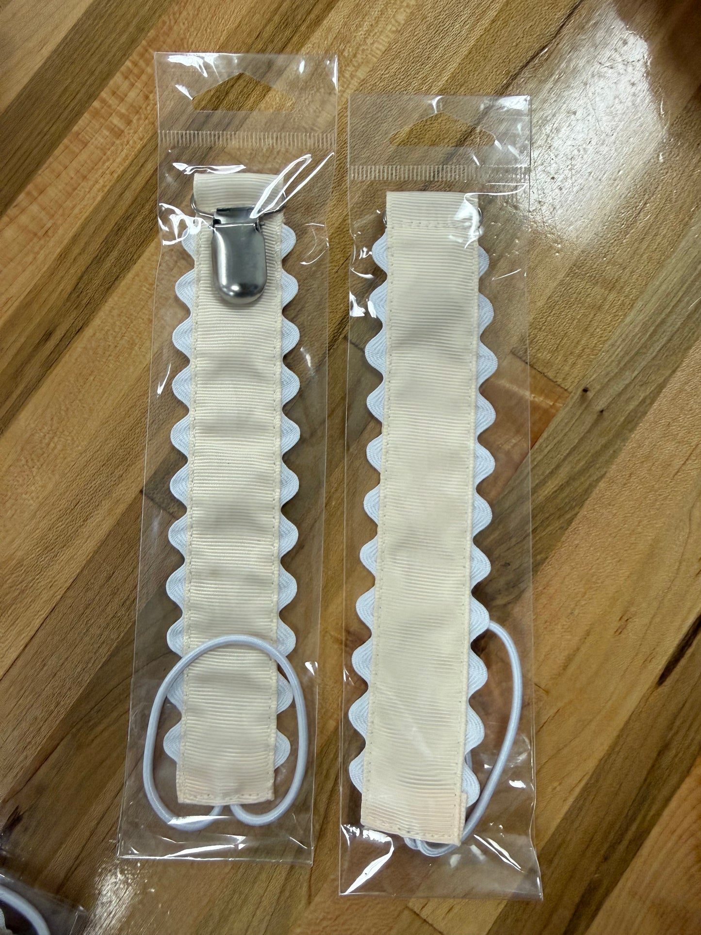 Ivory scalloped pacifier holder with metal clip 