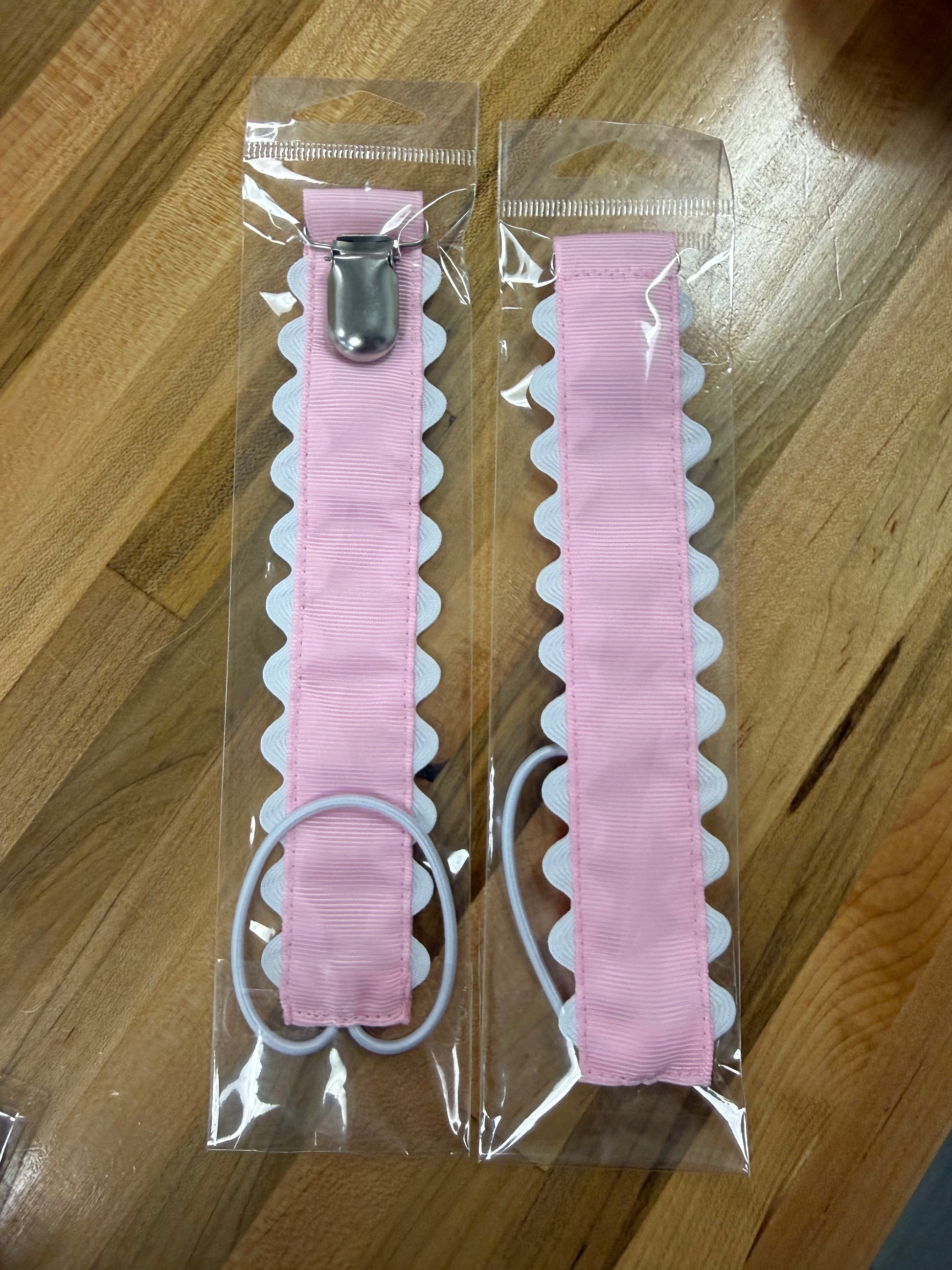 Pink scalloped pacifier holder with metal clip 