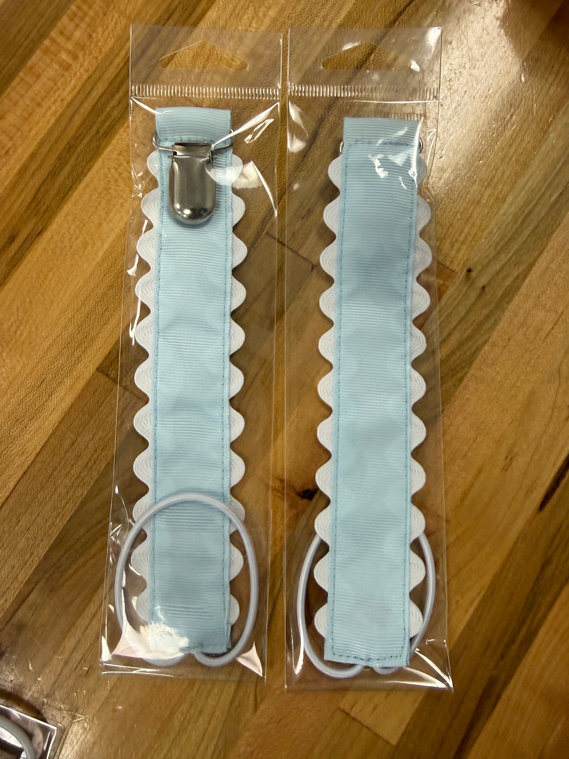 Blue scalloped pacifier holder with metal clip 