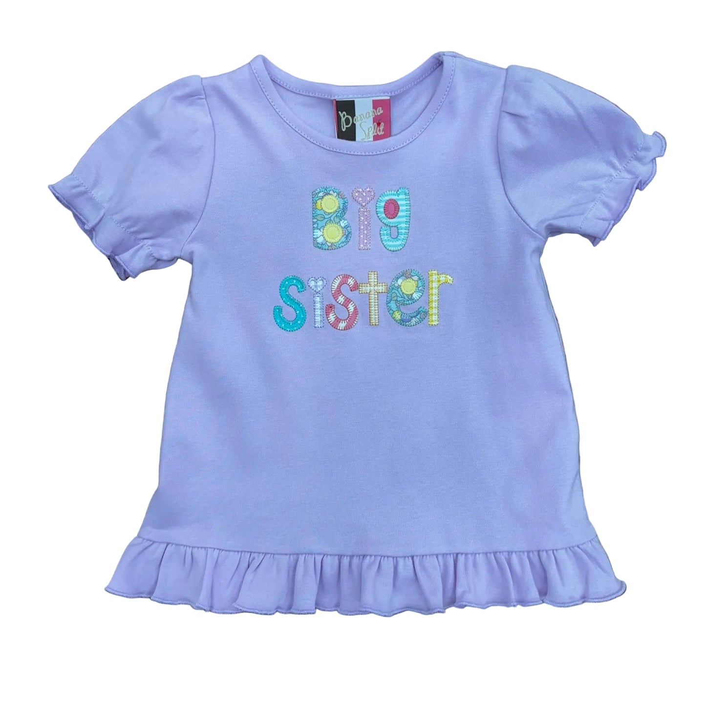 Pale purple shirt with ruffled sleeves and bottom trim and Big Sister applique.