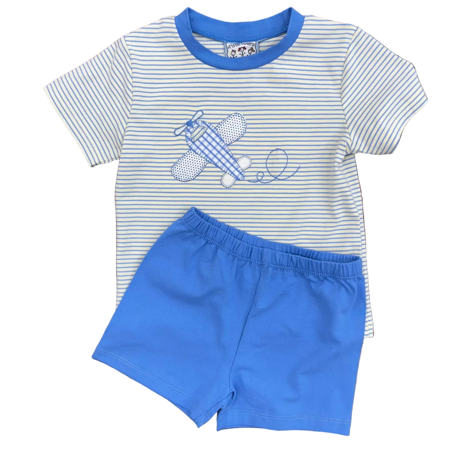 Blue striped shirt on pale yellow background with airplane applique and embroidery. Short sleeves, blue trim around collar and matching blue shorts