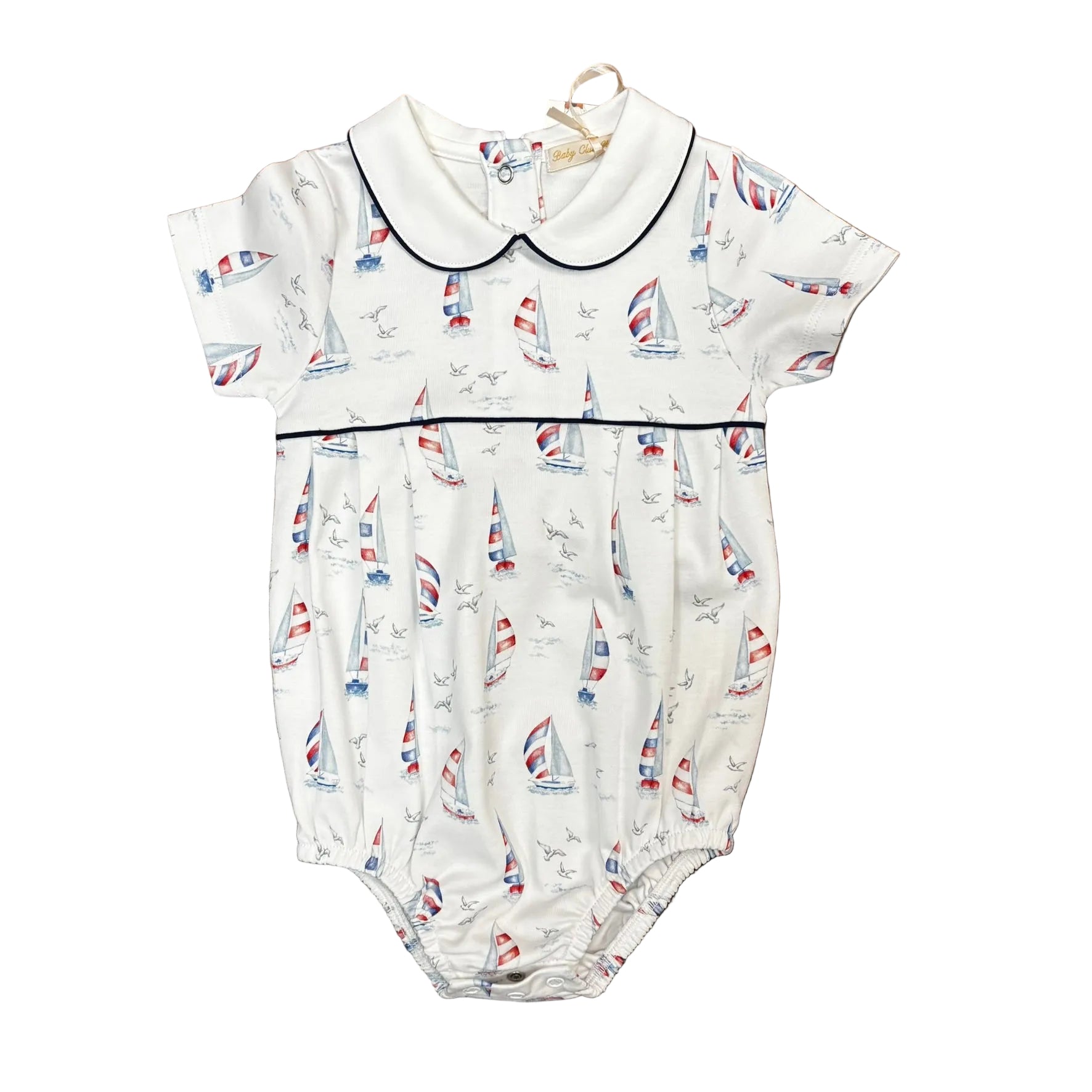 White bubble with a red white and blue sailboat pattern, a round collar and blue piping.