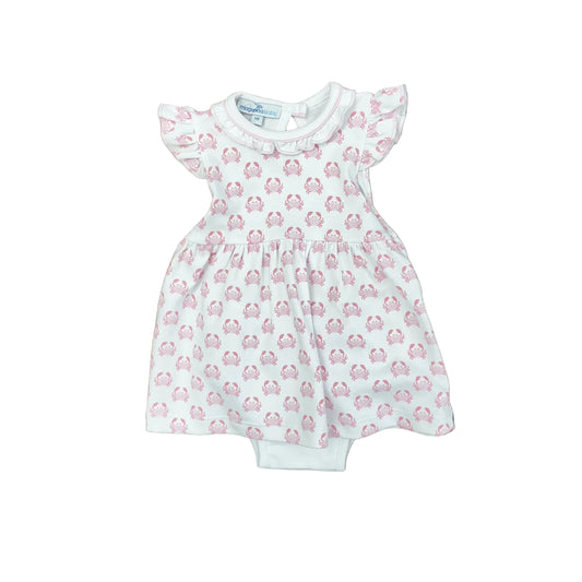 White top and bloomers, top has ruffle sleeves and collar and a pink crab pattern.