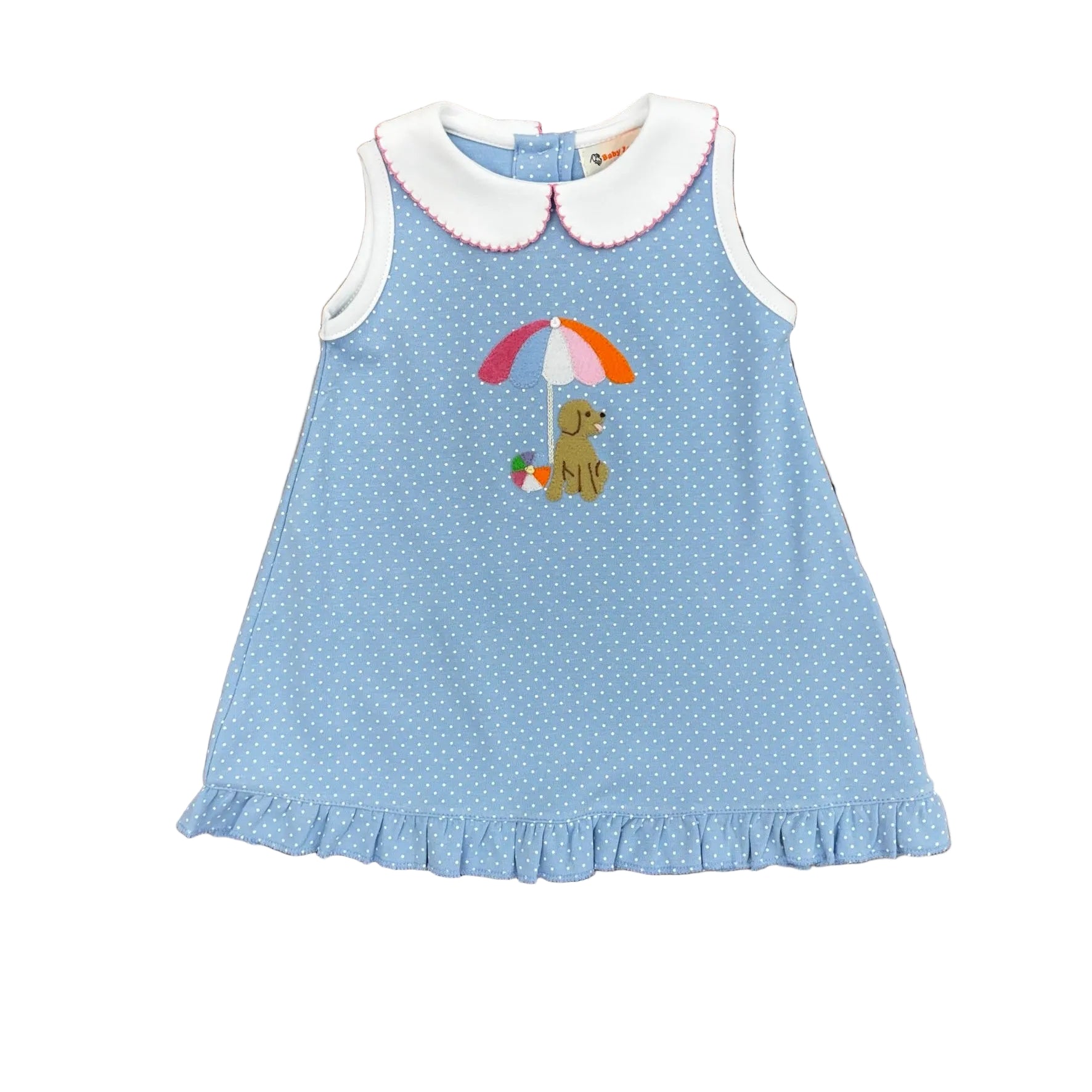 Light blue sleeveless dress with white polka dots, white trim and collar, a ruffled hem, and a puppy, beach ball and beach umbrella applique.