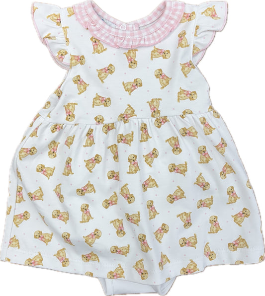 White dress with ruffle sleeves, a pink gingham ruffle collar and a golden retriever pattern.