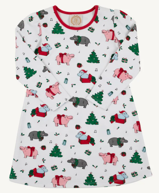 White long sleeve dress with red trim and a Christmas pattern with trees and hippos.