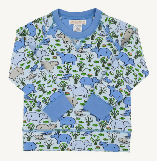 Long sleeved shirt with hippo print and blue trim.