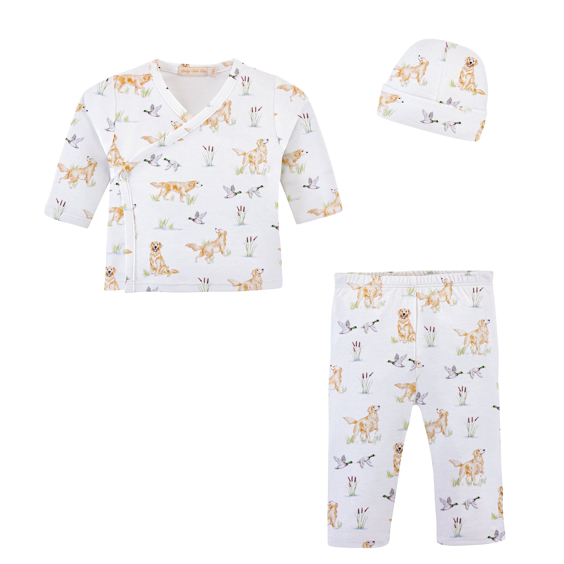 A three-piece baby clothing set featuring a long-sleeve wrap top, matching pants, and a beanie. The set is white with a playful print of goldens and mallards