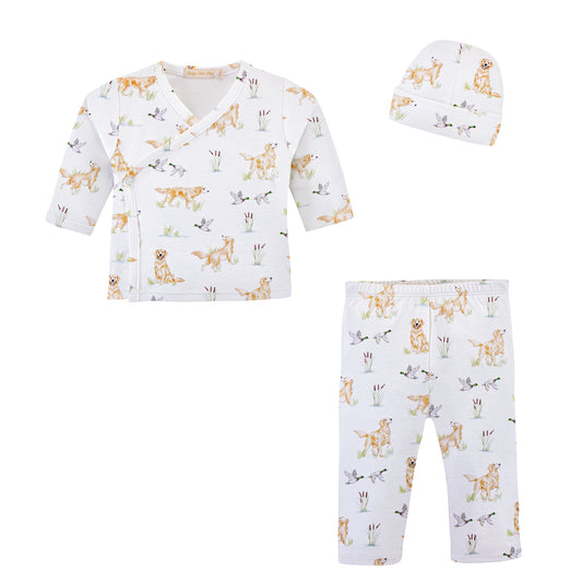 A three-piece baby clothing set featuring a long-sleeve wrap top, matching pants, and a beanie. The set is white with a playful print of goldens and mallards