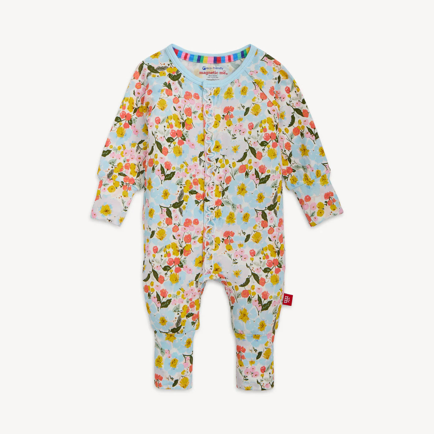 Pink and yellow flower pattern on a light teal baby one piece convertible coverall