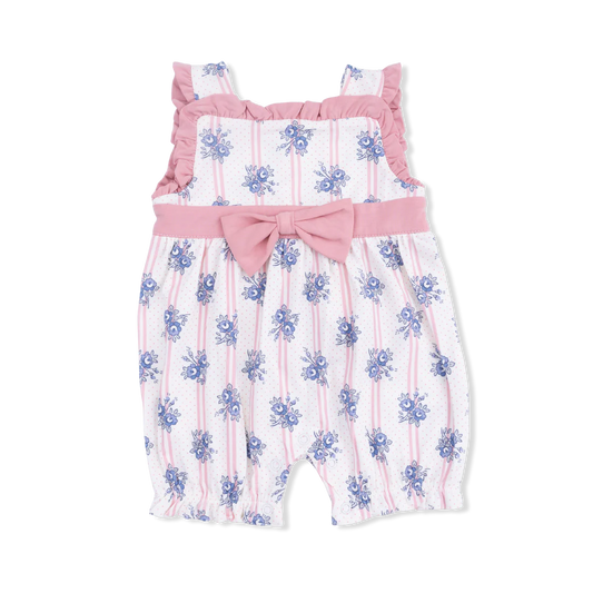One piece playsuit with a pink bow and ruffle detail, pink stripes and blue flowers.