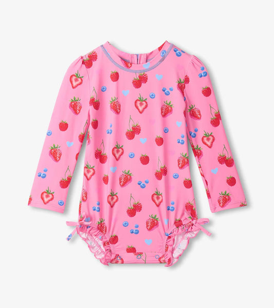 Pink long sleeve one piece swimsuit with allover strawberry pattern.