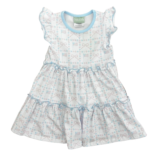 Pink and blue flags and bows on a ruffled blue trimmed dress.