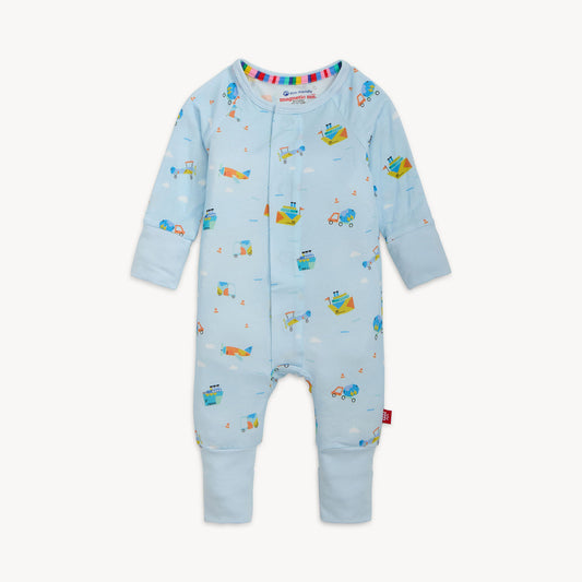 Light blue baby one piece with an overall vehicle print.