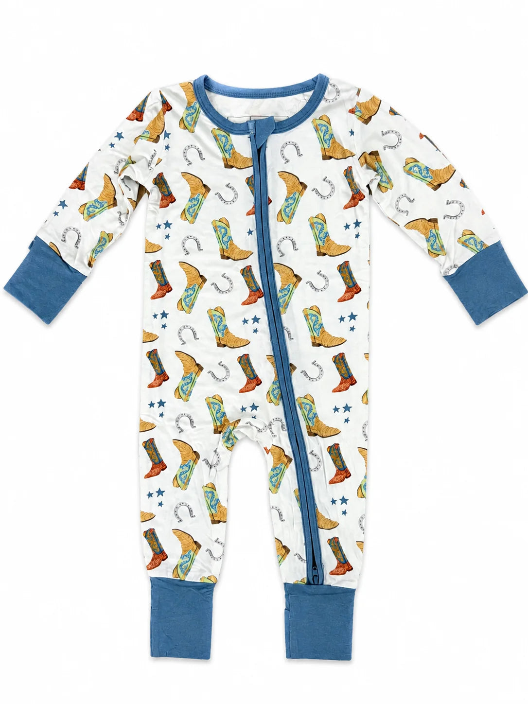 A baby long-sleeve footed sleeper with a white background, featuring a colorful cowboy boot and horseshoe print, blue cuffs, and a blue front zipper.
