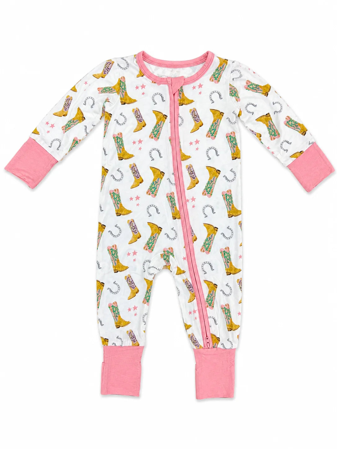 A baby long-sleeve footless zip-up sleeper in white with a pink zipper, pink cuffs, and pink foot cuffs, featuring an all-over print of yellow cowboy boots, horseshoes, and pink stars.