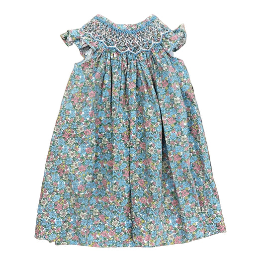 Teal dress with floral pattern, ruffle sleeves and a smocked bodice.