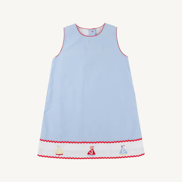 Light blue dress with red rick rack trim and sailboat patterns on the bottom 