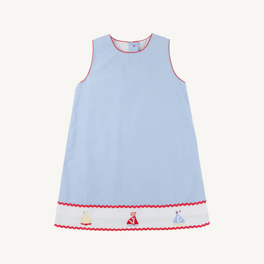 Light blue dress with red rick rack trim and sailboat patterns on the bottom 