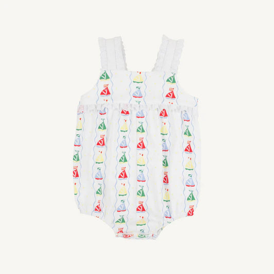 White romper with colorful sailboat pattern on a white background